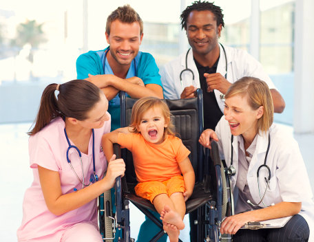happy doctors with a cute kid